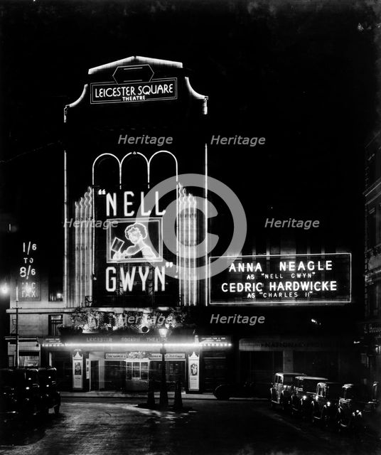 Night view of the Leicester Square theatre, London, c1930. Artist: Larkin