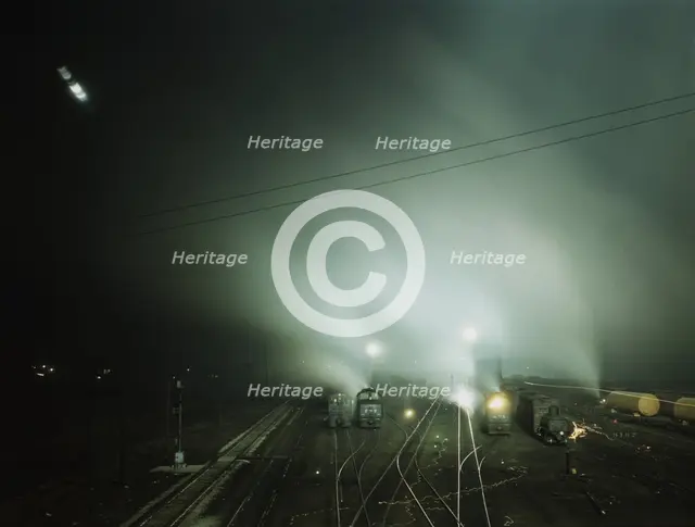 Night view of part of Santa Fe R.R. yard, Kansas City, Kansas, 1943. Creator: Jack Delano.
