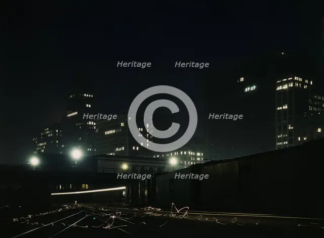 Night view of part of the South Water street freight terminal...Illinois Central R.R., Chicago, 1943 Creator: Jack Delano.