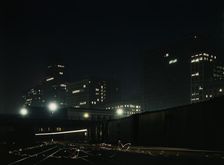 Night view of part of the South Water street freight terminal...Illinois Central R.R., Chicago, 1943 Creator: Jack Delano
