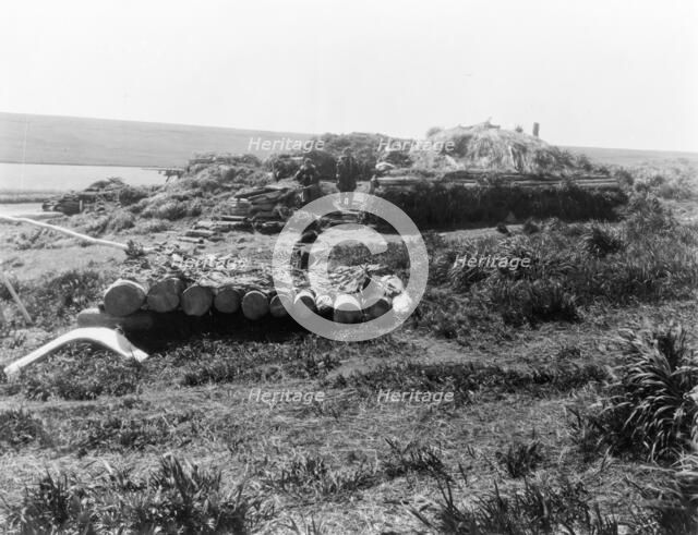 Nihkoyak, men's house at winter camp-Nunivak, c1929. Creator: Edward Sheriff Curtis.