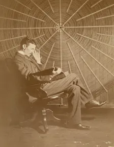 Nikola Tesla and his spiral oscillating transformer, 1896. Creator: Anonymous