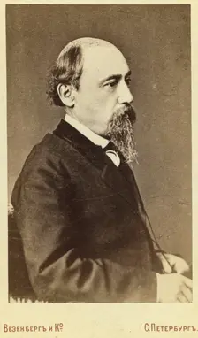 Nikolay Alexeyevich Nekrasov, half-length portrait, facing right, between 1880 and 1886. Creator: Unknown