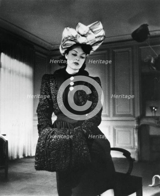 Nina Ricci outfit worn by the fashion model Gabrielle, France, January 1943. Artist: Unknown