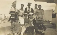 Nine men dressed up on deck, [between 1920 and 1929?]. Creator: Unknown