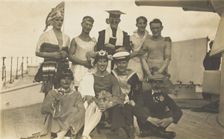 Nine men dressed up on deck, [between 1920 and 1929?]. Creator: Unknown