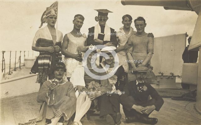 Nine men dressed up on deck, [between 1920 and 1929?]. Creator: Unknown.