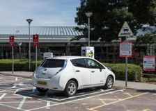 Nissan Leaf at elctric charging point 2015. Creator: Unknown