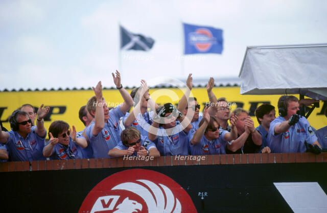 Nissan team celebrate victory 1998 British touring cars.. Artist: Unknown.