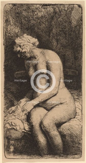 Nude Seated on a Bench with a Pillow (Woman Bathing Her Feet at a Brook), 1658. Creator: Rembrandt Harmensz van Rijn.