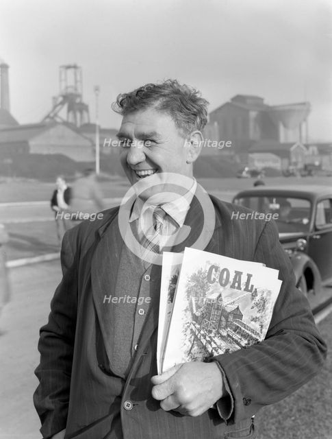 NUM official selling "Coal" magazine, South Yorkshire, 1959. Creator: Michael Walters.