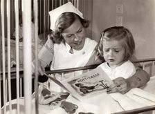 Nurse and her young patient at a children's hospital, Stockholm, Sweden, 1940s. Creator: Karl Sandels