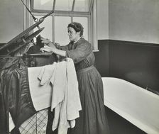 Nurse using a steriliser in the bathroom at Chaucer Cleansing Station, London, 1911