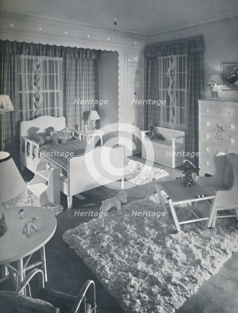 'Nursery by W. & J. Sloane, with cream-coloured furniture and shaggy white rugs on a blue painted fl Artist: Unknown.