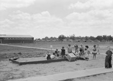 Nursery school children with their teacher, FSA camp, Tulare County, California, 1939. Creator: Dorothea Lange