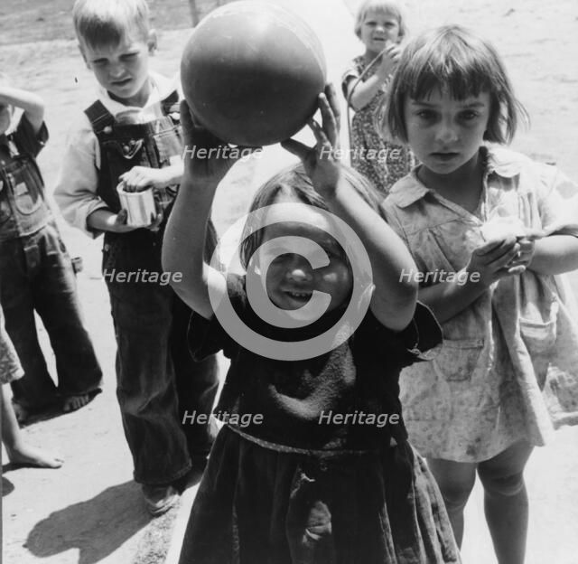 Nursery school, showing migrant children playing, FSA camp, Tulare County, 1939. Creator: Dorothea Lange.