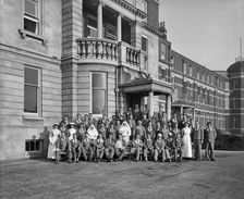 Nurses, nuns and military patients outside St Andrew's Hospital, Dollis Hill, London, October 1916. Artist: Adolph Augustus Boucher