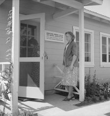 Nurse's help with sick baby, FSA camp, Farmersville, Tulare County, California, 1939. Creator: Dorothea Lange