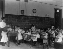 Small children studying geometry in a classroom in Washington, D.C., (1899?). Creator: Frances Benjamin Johnston
