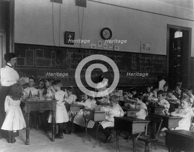 Small children studying geometry in a classroom in Washington, D.C., (1899?). Creator: Frances Benjamin Johnston.