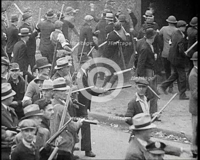 Small Crowd of American Civilians on a Demonstration/Strike in Conflict with the Police, 1930. Creator: British Pathe Ltd.