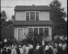 Small Crowd of American Civilians Gathering Outside Bruno Richard Hauptman's House in the..., 1930s. Creator: British Pathe Ltd