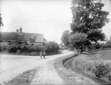 Small boy and a donkey on a road leading into Chalgrove, Oxfordshire, c1860-c1922. Artist: Henry Taunt