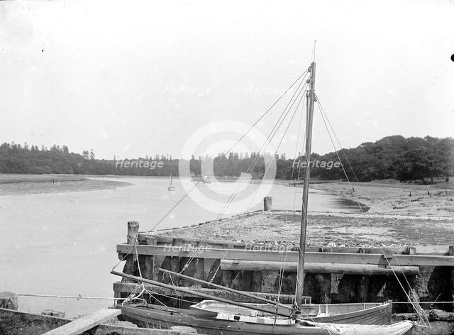 Small boats moored alongside a town jetty, Beaulieu, Hampshire, c1860-c1922. Artist: Henry Taunt