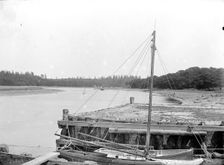 Small boats moored alongside a town jetty, Beaulieu, Hampshire, c1860-c1922. Artist: Henry Taunt