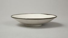 Small Ding-type bowl with incised peony scroll and dragon, 20th century