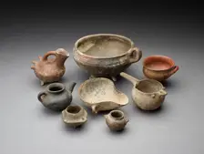 Small open mouth vessel with extended ledge and 2 handles around the body