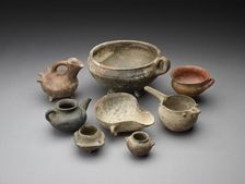 Small open mouth vessel with extended ledge and 2 handles around the body