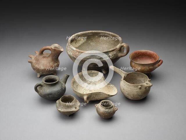 Small open mouth vessel with extended ledge and 2 handles around the body. Artist: Unknown.