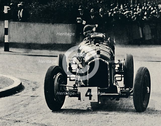 'Smart cornering in I.O.M. Race: The Hon. Brian Lewis', 1937. Artist: Unknown.