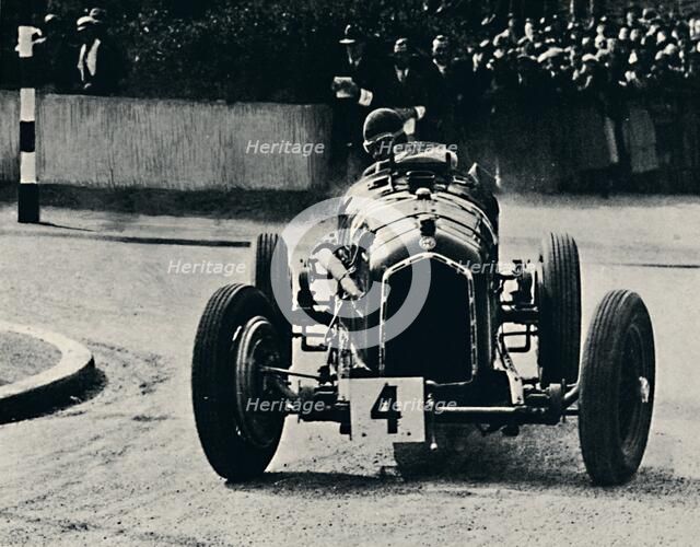 'Smart cornering in I.O.M. Race: The Hon. Brian Lewis', 1937. Artist: Unknown.