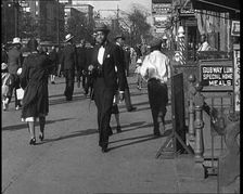 Smartly Dressed People Walking Along the Streets of New York City, 1932. Creator: British Pathe Ltd