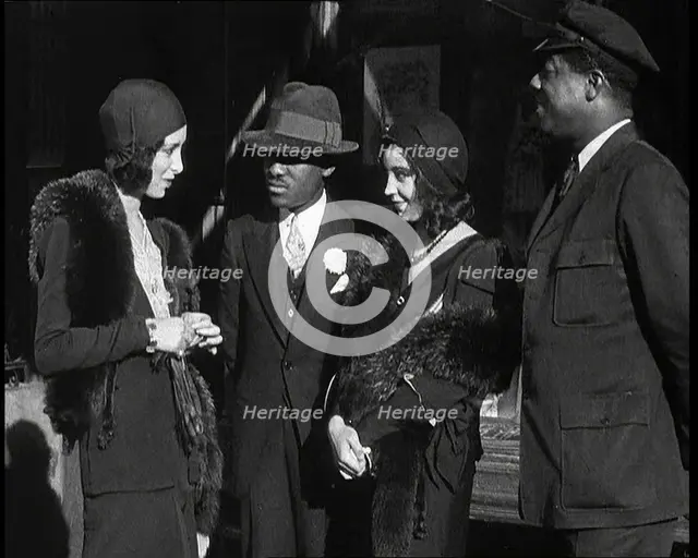 Smartly Dressed People in Conversation On the Streets of New York City, 1932. Creator: British Pathe Ltd.