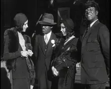 Smartly Dressed People in Conversation On the Streets of New York City, 1932. Creator: British Pathe Ltd
