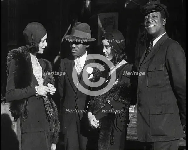 Smartly Dressed People in Conversation On the Streets of New York City, 1932. Creator: British Pathe Ltd.