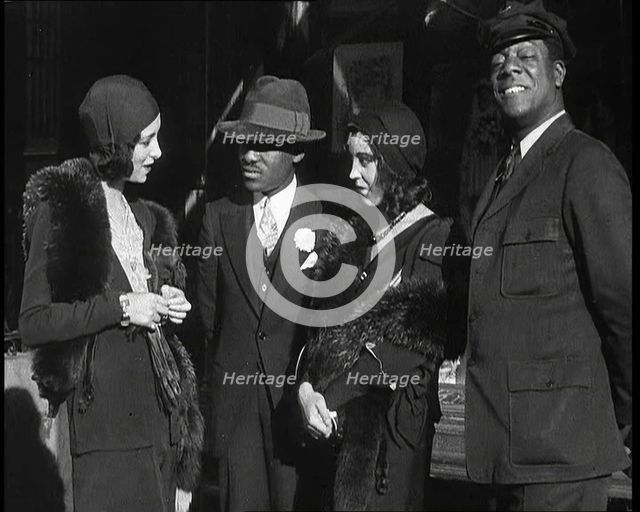 Smartly Dressed People in Conversation On the Streets of New York City, 1932. Creator: British Pathe Ltd.