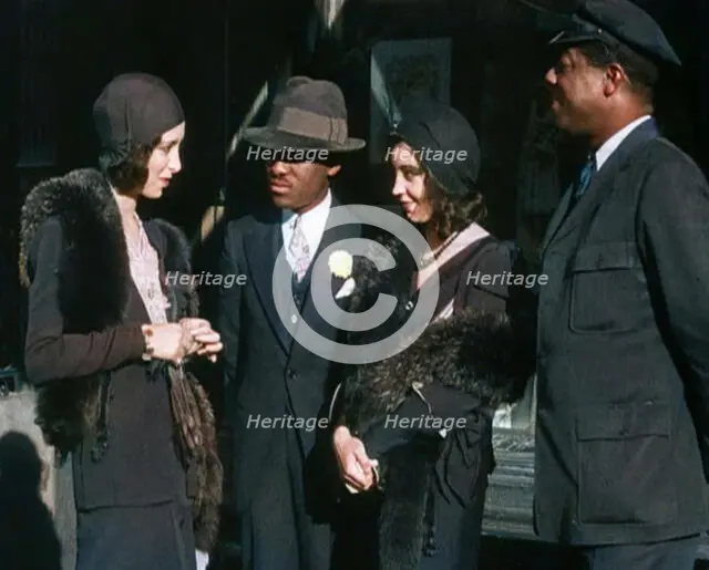 Smartly Dressed People in Conversation On the Streets of New York City, 1932. Creator: British Pathe Ltd.