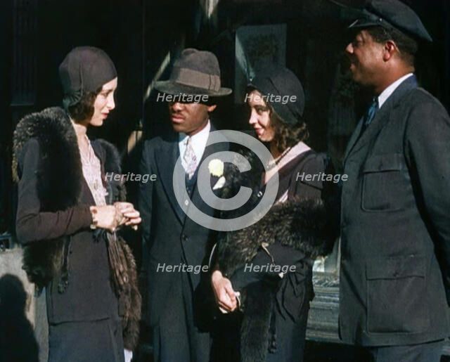 Smartly Dressed People in Conversation On the Streets of New York City, 1932. Creator: British Pathe Ltd.