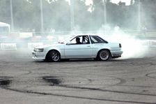 Smoking tyres during tyre burn-out. Creator: Unknown