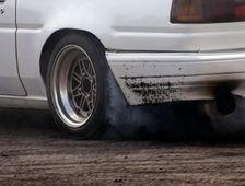 Smoking tyres during tyre burn-out. Creator: Unknown