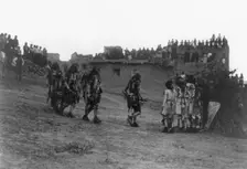 Snake dancers entering the plaza, c1905. Creator: Edward Sheriff Curtis