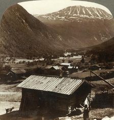 Snowy heights of Mt. Gausta (6180 ft.), above quiet homes in Maan Valley, Norway c1905. Creator: Unknown