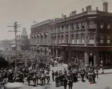 South Africa: a crowd of people gathered outside The Goldfields offices in Johannesburg, 1896. Creator: Unknown