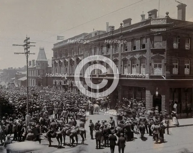 South Africa: a crowd of people gathered outside The Goldfields offices in Johannesburg, 1896. Creator: Unknown.
