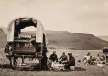 South Africa: a group of Europeans eating a meal beside their wagon in the Transvaal, c1890s. Creator: Dudley Kidd