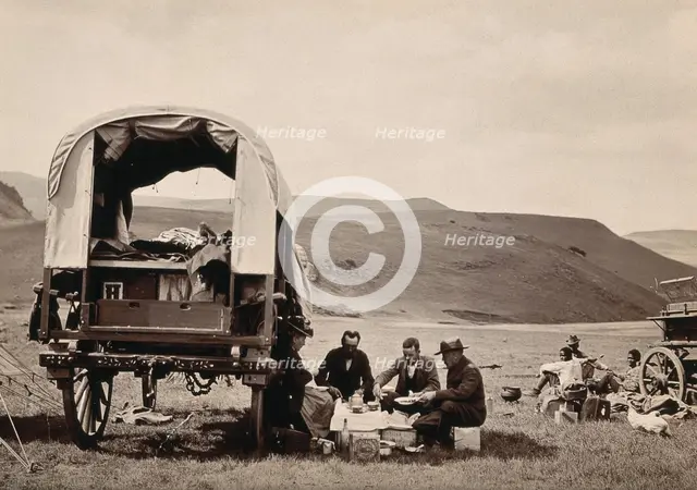 South Africa: a group of Europeans eating a meal beside their wagon in the Transvaal, c1890s. Creator: Dudley Kidd.